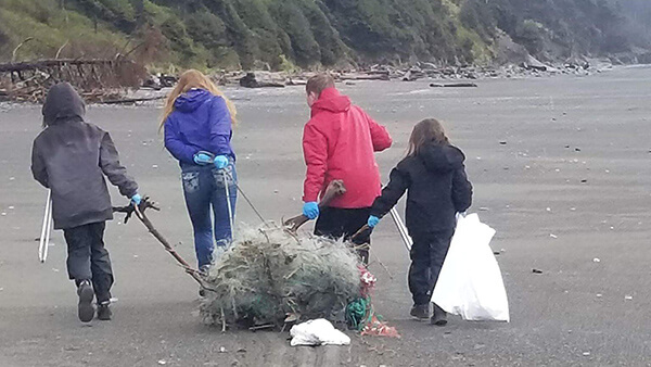 people clean up a beach